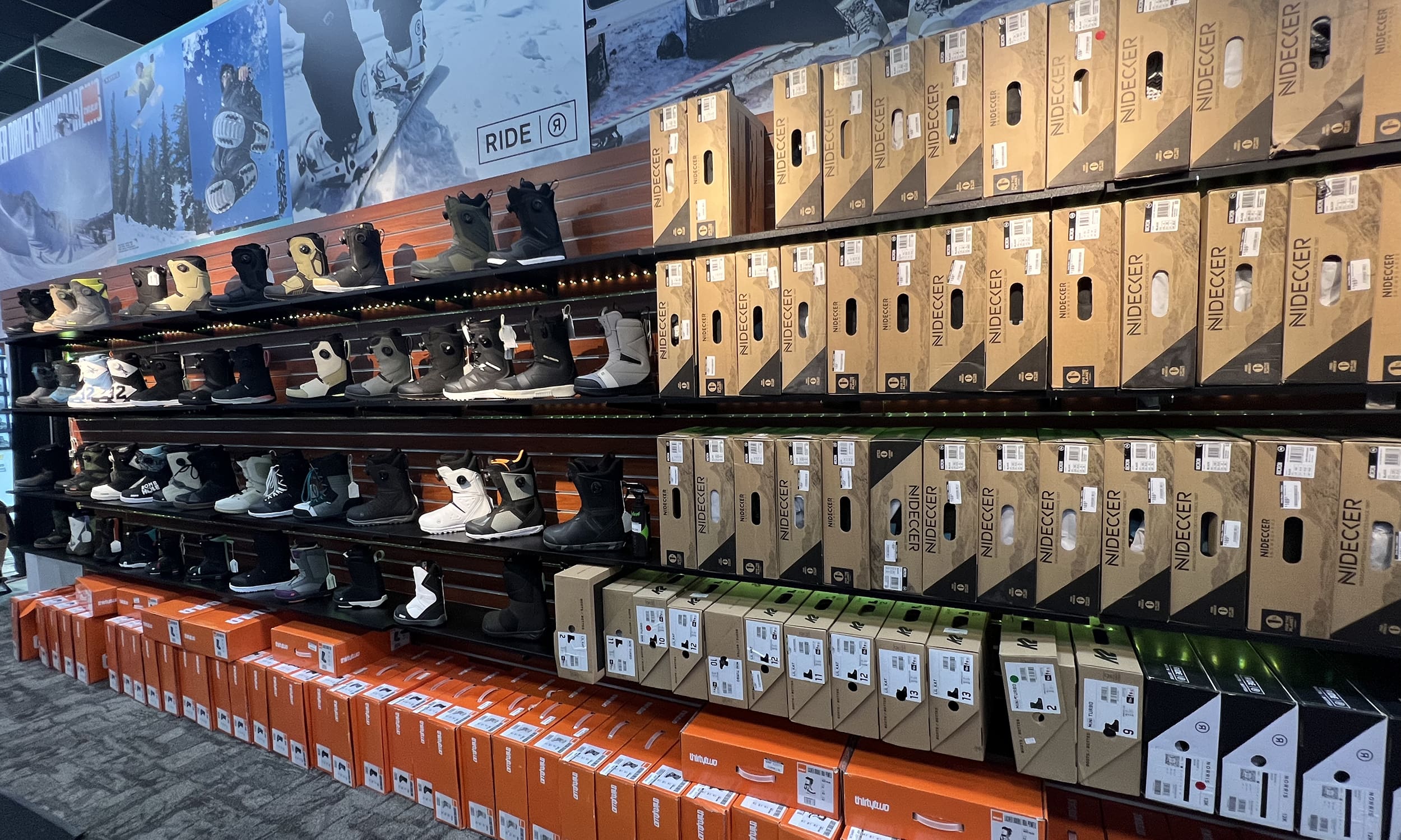 A store with many pairs of shoes on display.