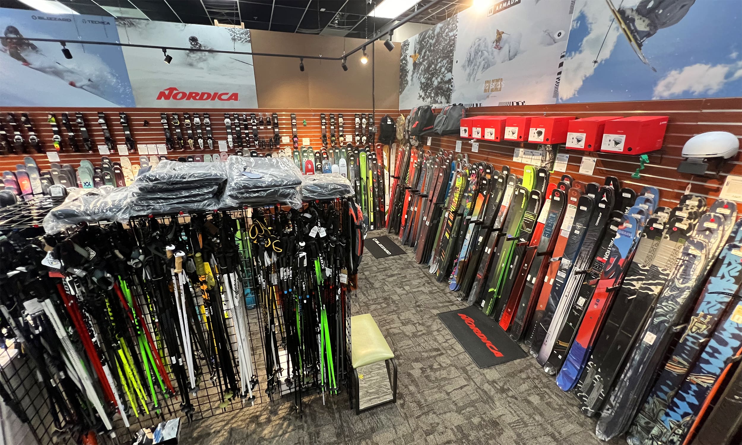 A room filled with lots of skis and poles.