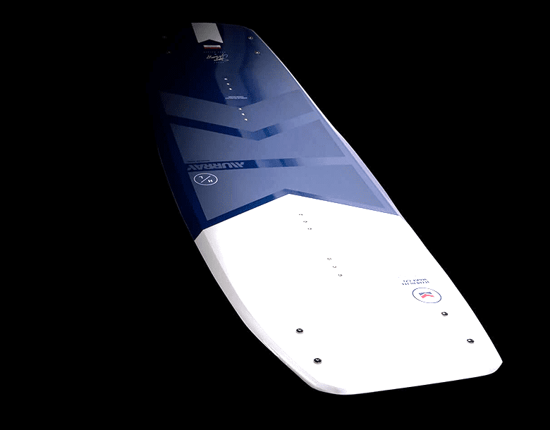 A blue and white surfboard is in the dark.