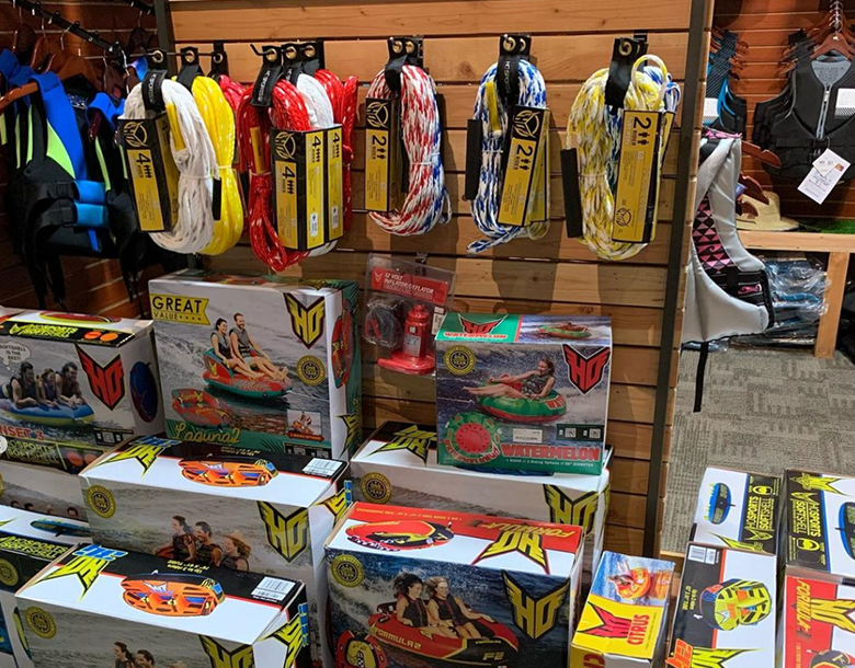 A display of water toys and ropes for sale.